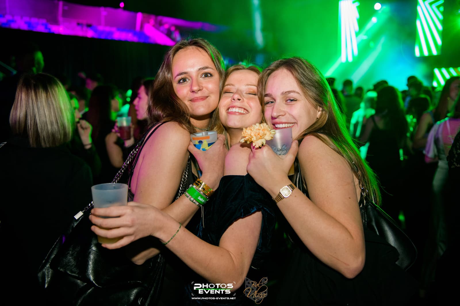 Three friends in front of the stage